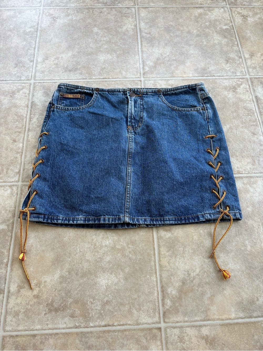 lei Blue Denim Mini Skirt with Gold Lace-Up Sides